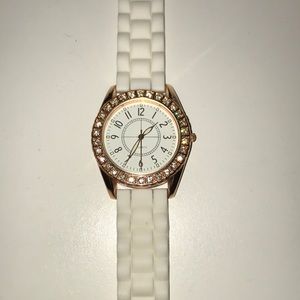 Rose gold watch with rhinestones and white band